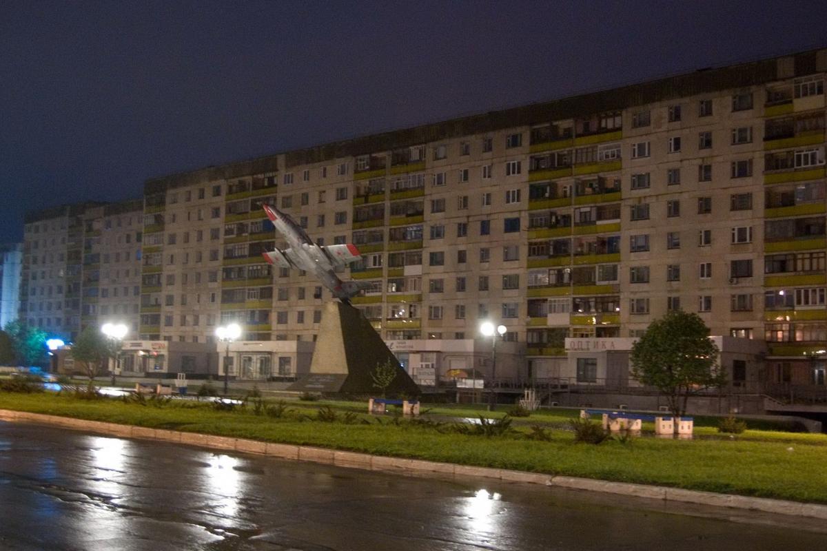 город