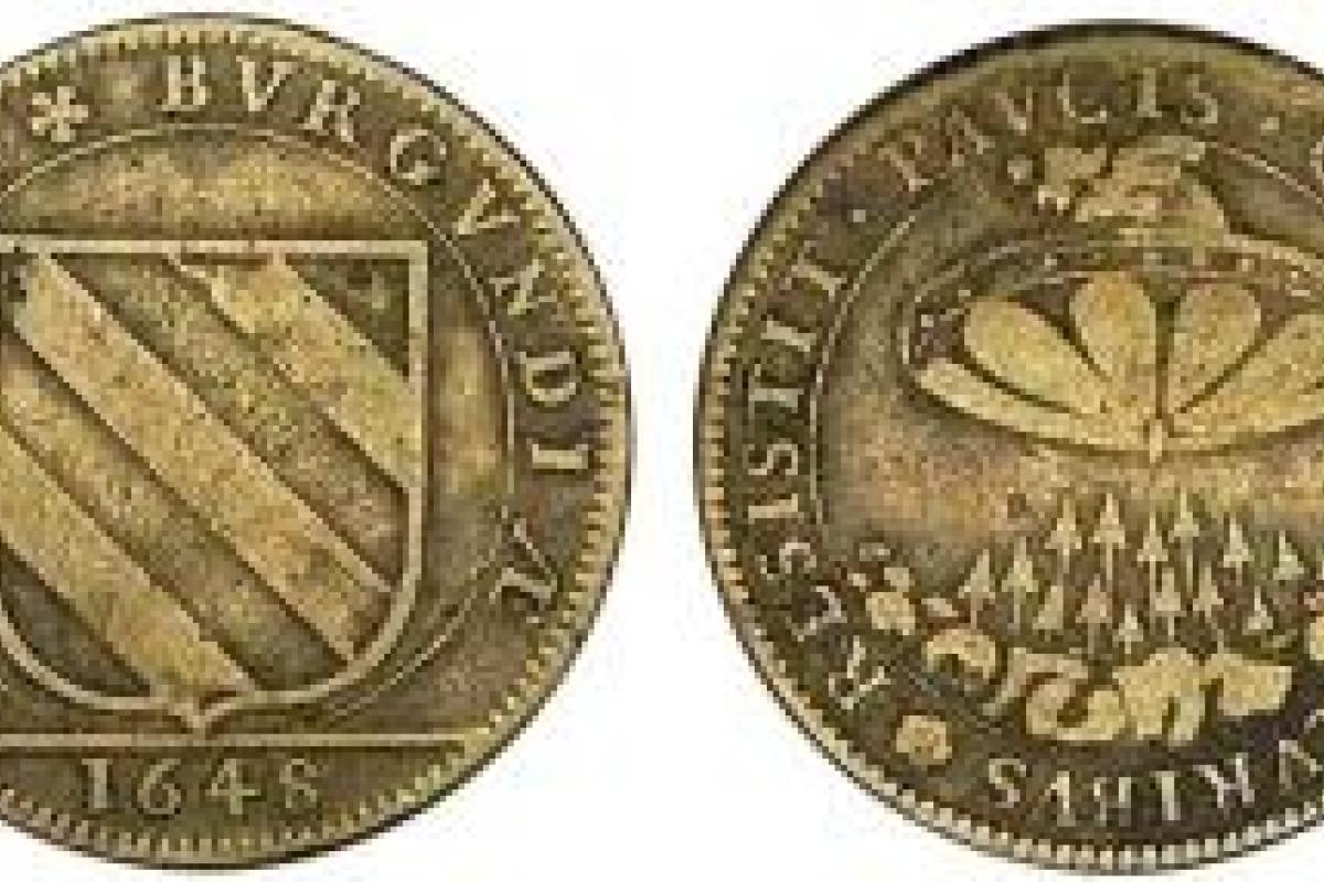 Таинственная монета с изображением НЛО не дает покоя ученым