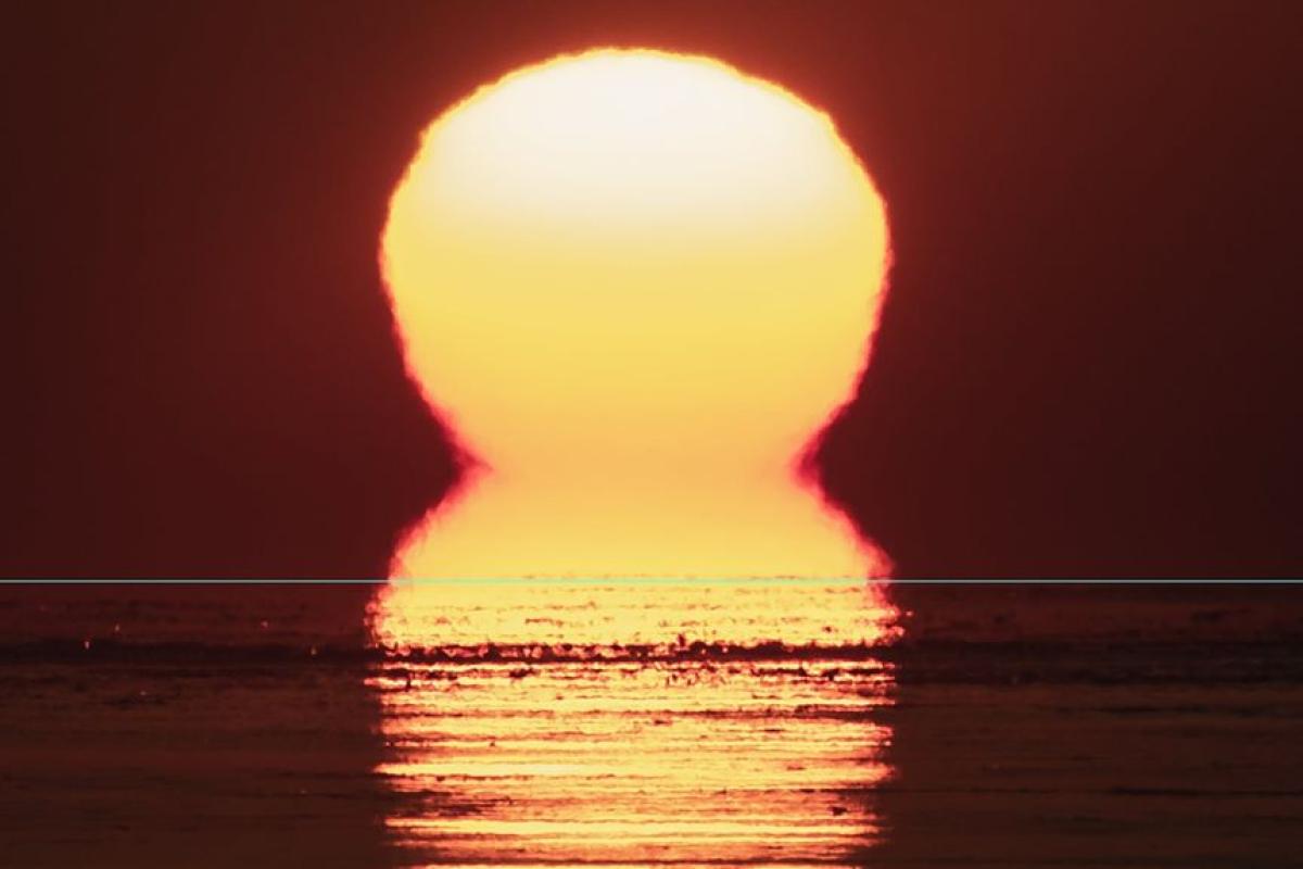 Взошло двойное Солнце: зрелищное явление попало в объектив фотографа в США Взошло двойное Солнце: зрелищное явление попало в объектив фотографа в США