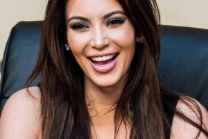 Папарацци застукали Ким Кардашьян на пляже в бикини