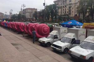 Киев атакуют розовые улитки