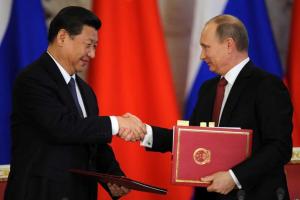 Германия просит Китай помочь "успокоить" Путина