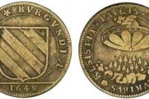 Таинственная монета с изображением НЛО не дает покоя ученым