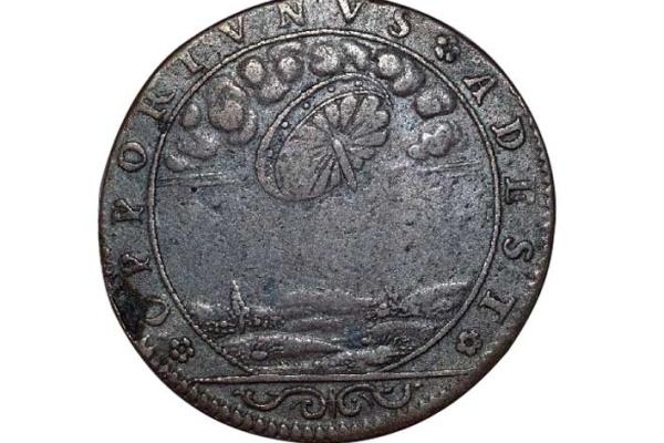 Таинственная монета с изображением НЛО не дает покоя ученым